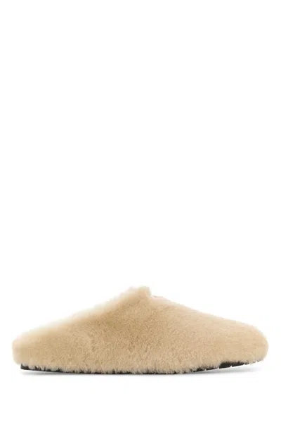Prada Triangle-logo Shearling Mules In Neutral