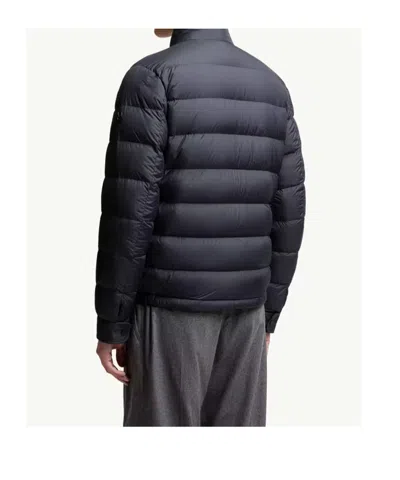 Moncler Quilted Down Jacket With High Collar And Logo Patch In Blue