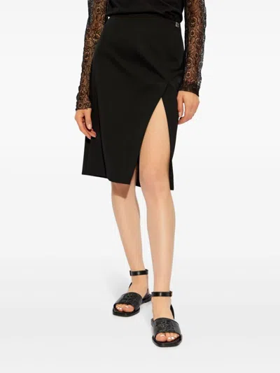 Givenchy Black Wool Skirt With Metal Button 4g In Black