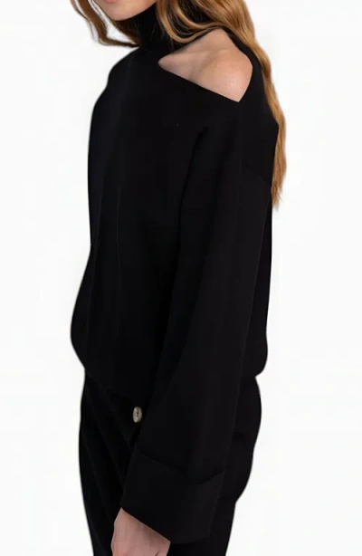 Modenaire Asymmetric Turtleneck Pullover And Button-front Slit Skirt Set In Black