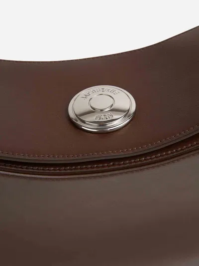 Jacquemus Le Calisso Rond Large Brown Shoulder Bag With Adjustable Strap And Embossed Logo In Leathe In Brown