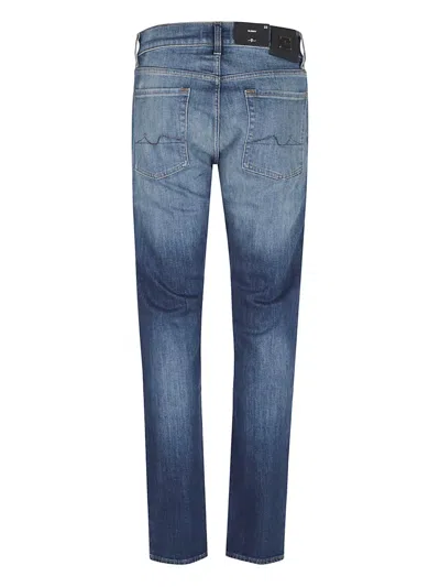 7 For All Mankind Mid-rise Slim-fit Stretch Denim Jeans With Tapered Hem In Blue