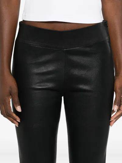 Arma Flared Trousers In Black