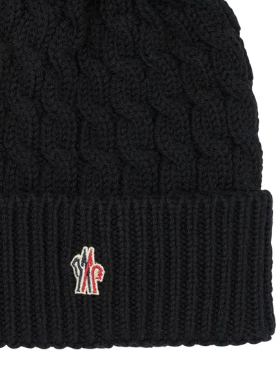 Moncler Wool Hat Featuring Cable Knit And Pom Detail In Black