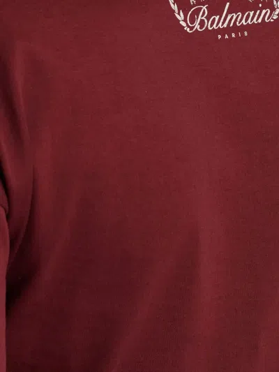 Balmain Twisted Button-embellished Top In Red