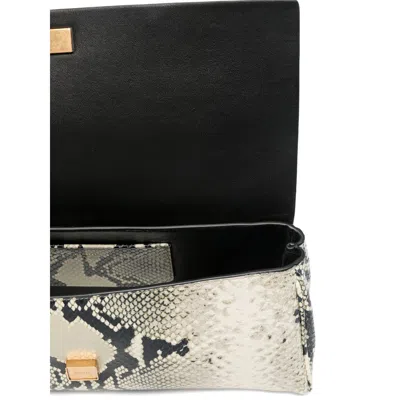 Khaite Leather Clutch Bags