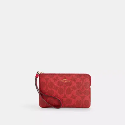 Coach Corner Zip Wristlet In Signature Canvas In Red