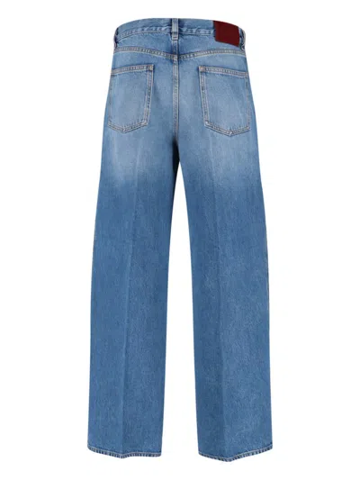 Gucci Blue Jeans With Logo Patch On The Rear And Faded Effect In Denim Woman
