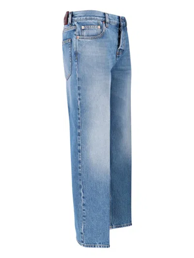 Gucci Blue Jeans With Logo Patch On The Rear And Faded Effect In Denim Woman