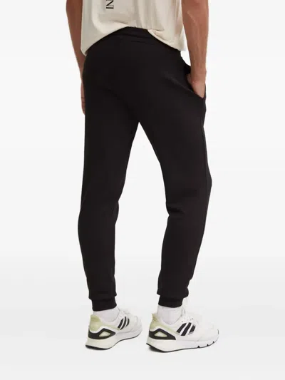 Ea7 Drawstring Logo Patch Trousers In Black