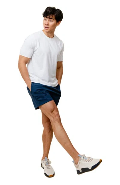 While On Earth™ Range Tee In White