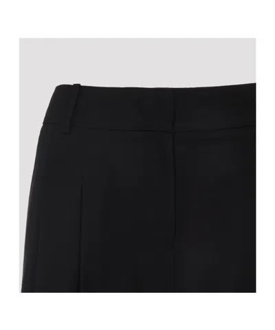 The Frankie Shop Wide-leg Trousers With Tailored Silhouette And Pleated Front In Black