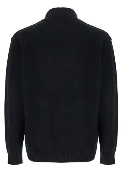 C.p. Company Black Jacket With High Neck And Logo Plaque On The Sleeve In Wool Blend Man In Black