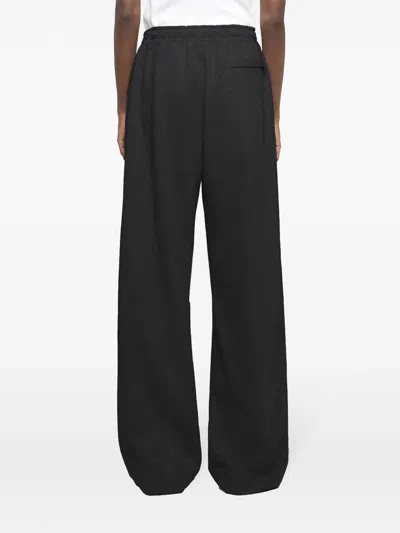 Jw Anderson J. W. Anderson Relaxed Wide-leg Trousers With Elastic Waistband In Black