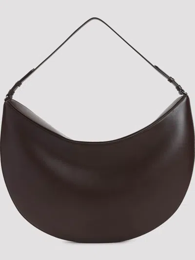 Jacquemus Le Calisso Rond Large Brown Shoulder Bag With Adjustable Strap And Embossed Logo In Leathe In Brown