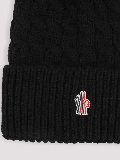 Moncler Wool Hat Featuring Cable Knit And Pom Detail In Black
