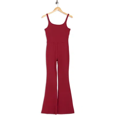 Yogalicious Felix Lux Ribbed Flare Leg Jumpsuit In Red