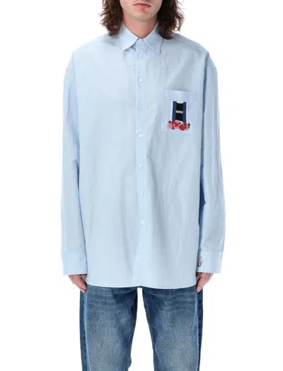 Jw Anderson Men Light Blue Shirt With Classic Collar And Embroidery Detail On Front And Cuff In Line In Blue