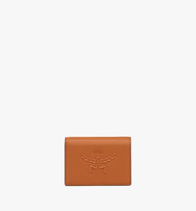 Mcm Embossed Logo Leather Mini Himmel Snap Wallet In Brown