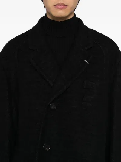Songzio Single-breasted Coat In Black