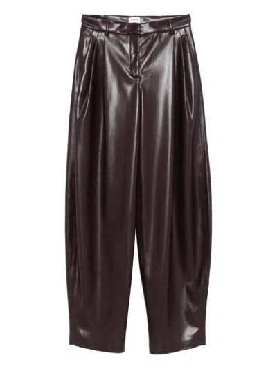 The Andamane Maxi Flare Vegan Leather Trousers In Brown