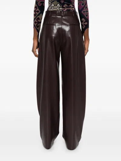 The Andamane Maxi Flare Vegan Leather Trousers In Brown
