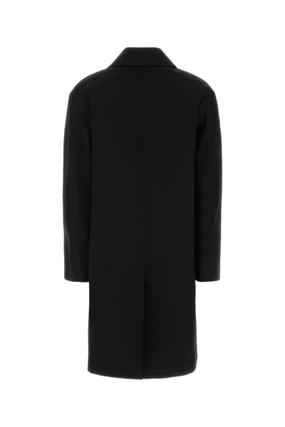 Saint Laurent Long Single-breasted Coat Featuring Side Pockets In Black