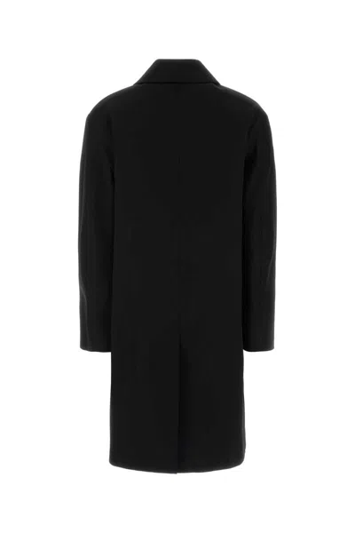 Saint Laurent Long Single-breasted Coat Featuring Side Pockets In Black