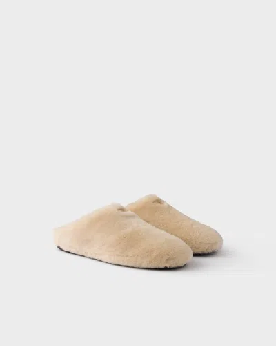 Prada Triangle-logo Shearling Mules In Nude