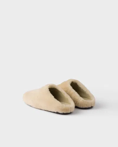 Prada Triangle-logo Shearling Mules In Nude