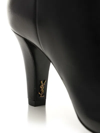 Saint Laurent Knee Length Stiletto Heel Pointed Toe Boots In Black