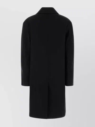 Saint Laurent Long Single-breasted Coat Featuring Side Pockets In Black