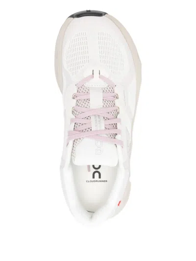 On Perforated Trainers In White