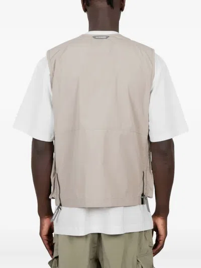 And Wander Zip-front Pocketed Vest In Neutral