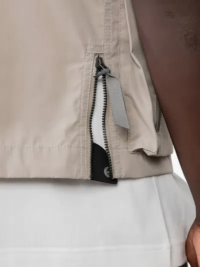 And Wander Zip-front Pocketed Vest In Neutral