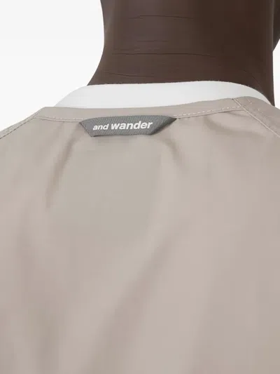 And Wander Zip-front Pocketed Vest In Neutral