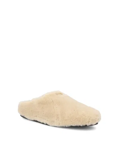Prada Triangle-logo Shearling Mules In Nude