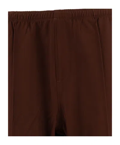 Needles Logo Embroidered Mid Rise Trousers In Brown