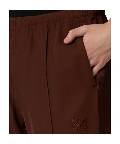 Needles Logo Embroidered Mid Rise Trousers In Brown