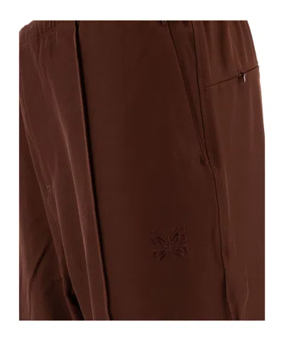 Needles Logo Embroidered Mid Rise Trousers In Brown
