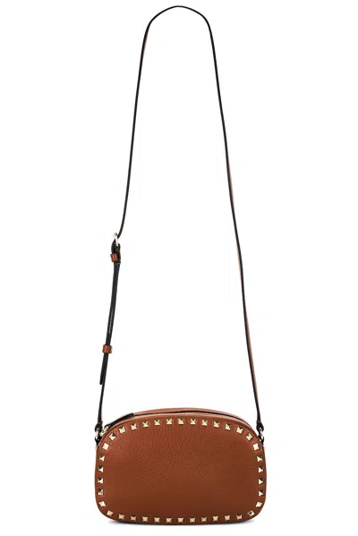 Valentino Rockstud Camera Case Bag In Brown