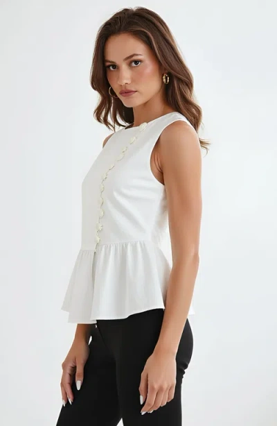 Modenaire Sleeveless Peplum Top With Asymmetric Pearl Button Front In White