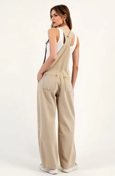 Modenaire Wide Leg Overalls With Adjustable Straps And Side Button Detail In Neutral