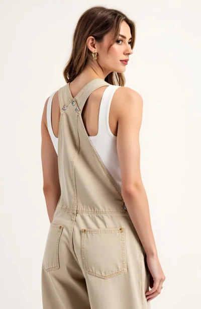 Modenaire Wide Leg Overalls With Adjustable Straps And Side Button Detail In Neutral
