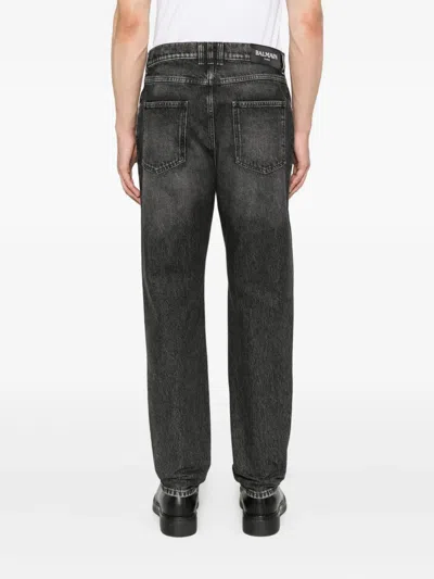Balmain Jeans With Logo Appliqué In Black