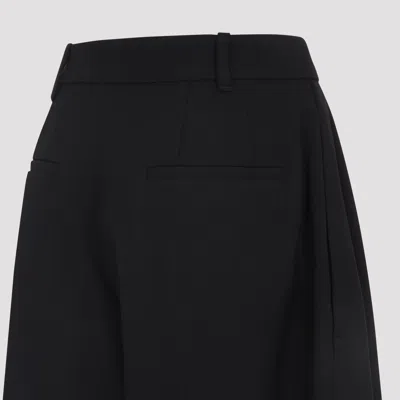 Jacquemus High-waisted Black Virgin Wool Pants With Curved Leg Silhouette In Black