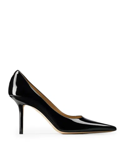 Jimmy Choo Patent Leather Pointy Toe Pumpss With Jc Emblem In Black