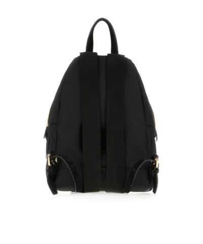 Moschino Logo-lettering Front-pocket Backpack In Black