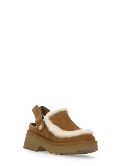 Ugg Suede Mules With Plush Trim And Adjustable Strap In Brown