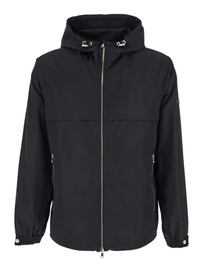 Tatras Black Jacket With Drawstring Hood And Logo Patch On The Sleeve In Tech Fabric Man In Black